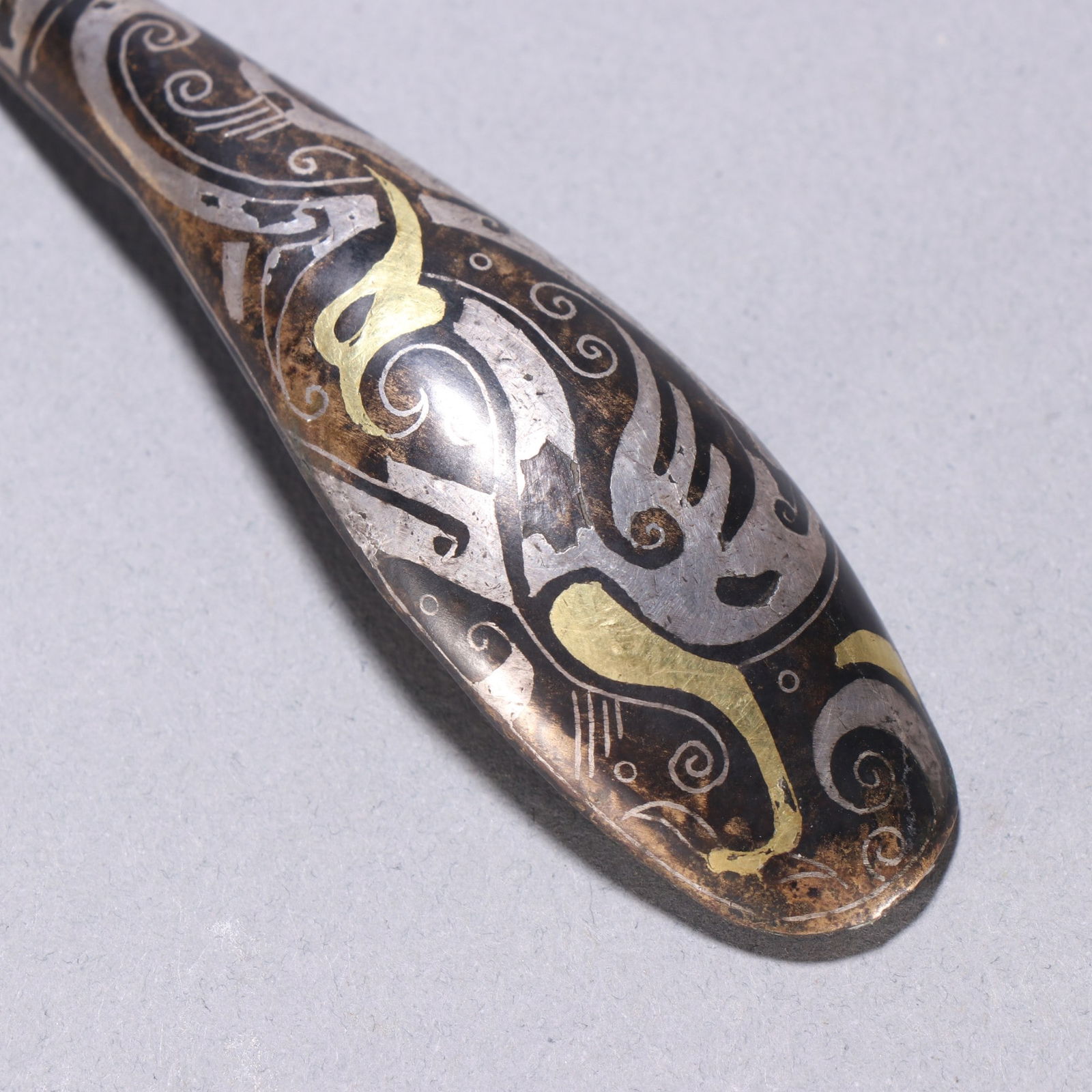 A fine copper wrong gold and silver strap hook - 3