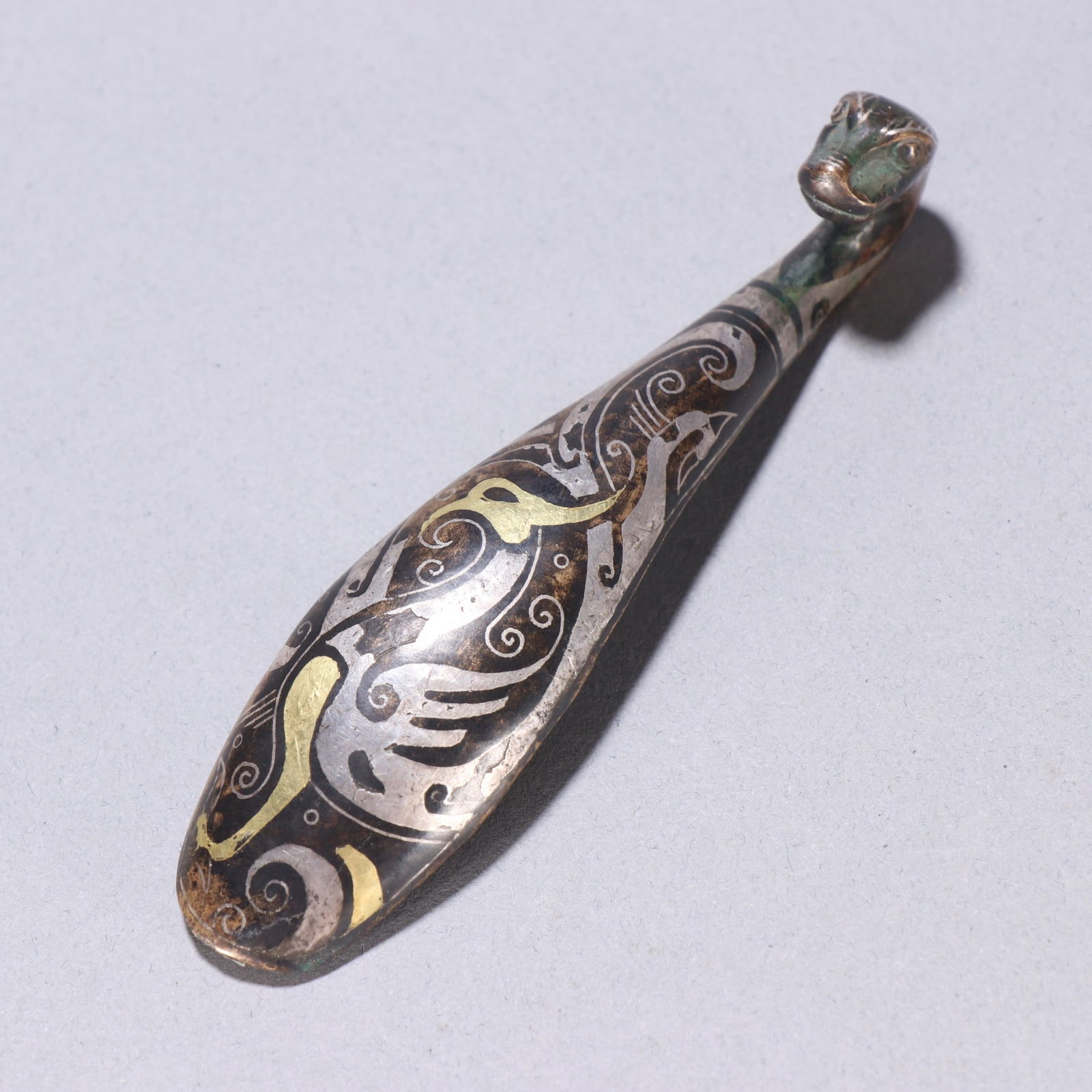 A fine copper wrong gold and silver strap hook - 4