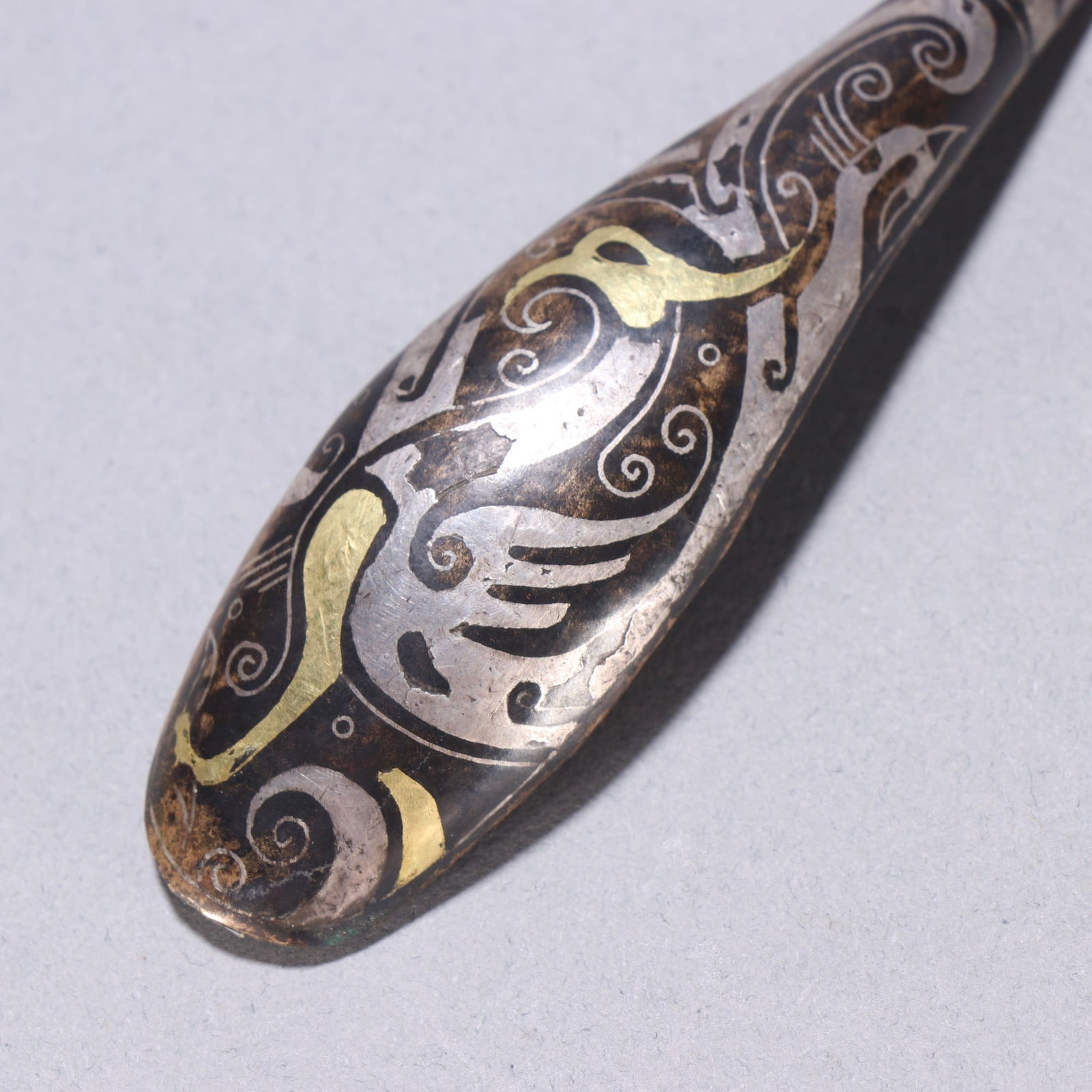 A fine copper wrong gold and silver strap hook - 5