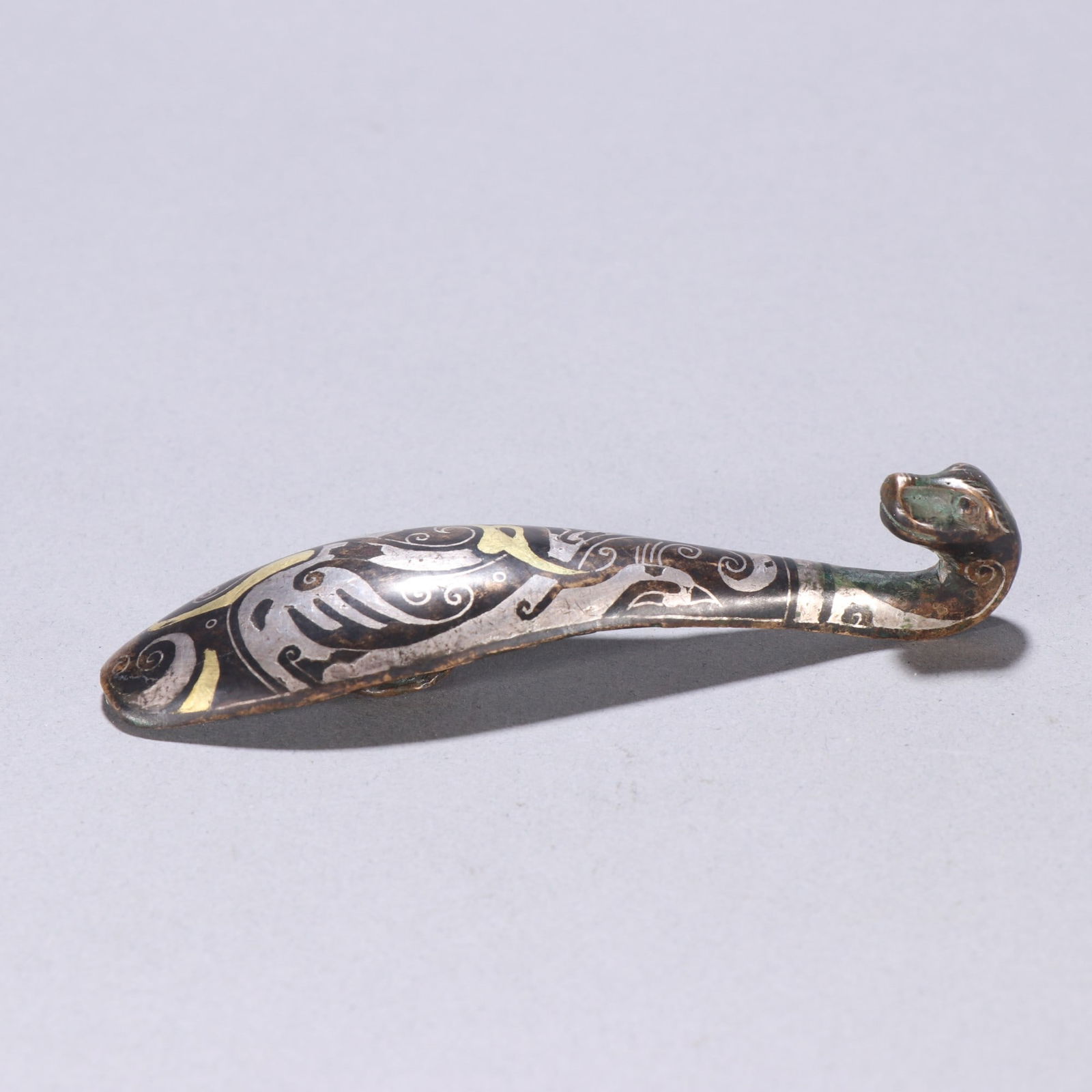 A fine copper wrong gold and silver strap hook - 7