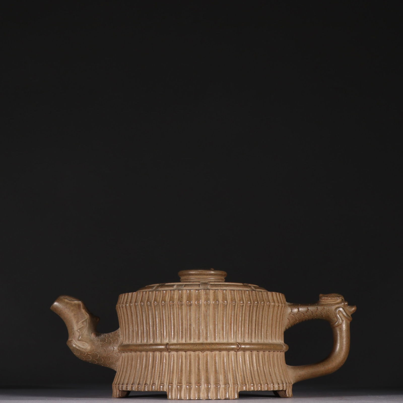 A purple sand bundle bamboo-shaped teapot of Wang Yinxian's style: Wang Yinxian's purple sand bundle bamboo-shaped teapot Size:H:7.8cmW:13cm (The Dimensions Of All Batches Are Manually Measured.If You Need More Detailed Information, Please Contact Our Customer Servic
