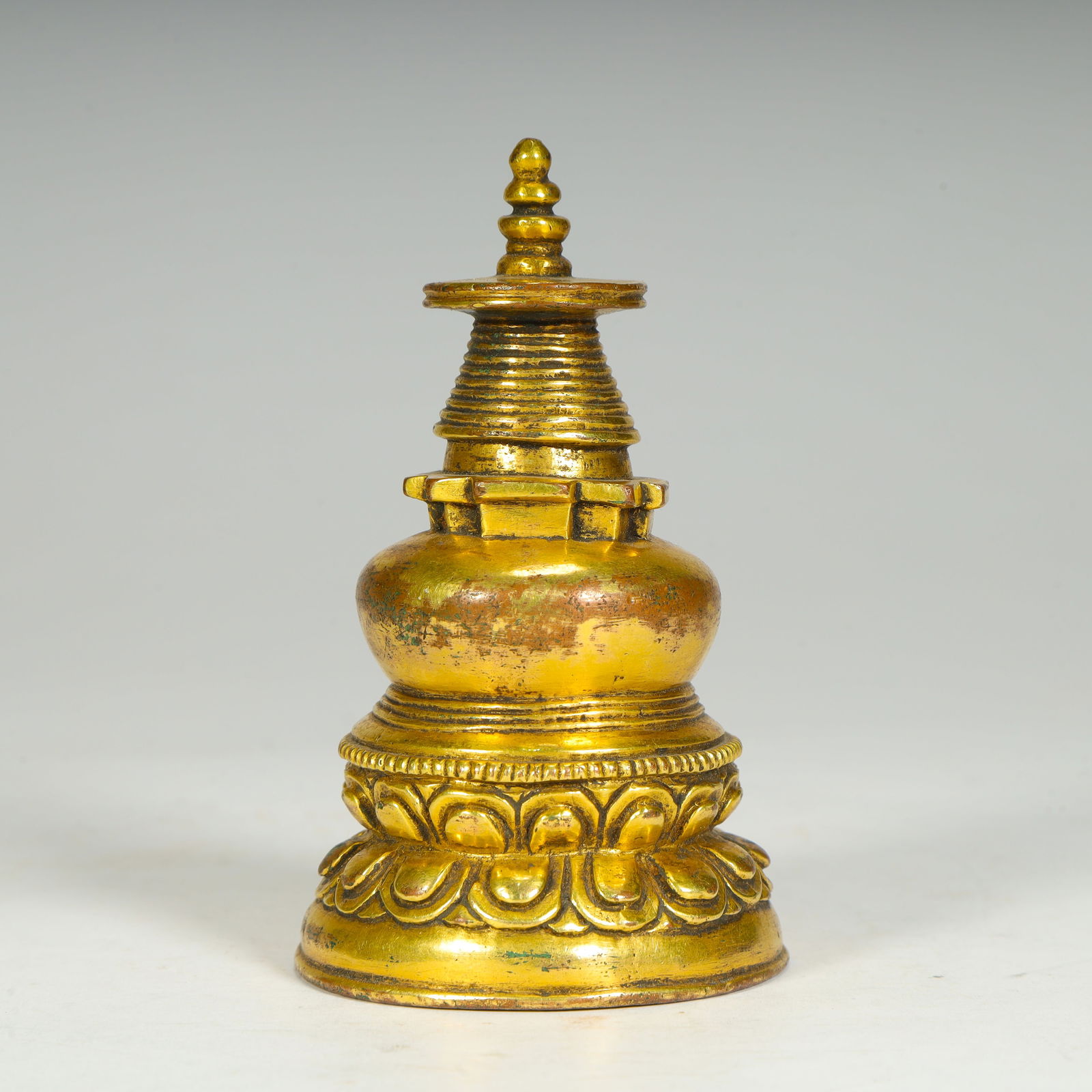 A Qing Dynasty copper-gilt treasure box sealed pagoda: Qing Dynasty copper-gilt treasure box printed pagoda Size:H:9cmL: 5cmW:5cmW:249g (The Dimensions Of All Batches Are Manually Measured.If You Need More Detailed Information, Please Contact Our Customer