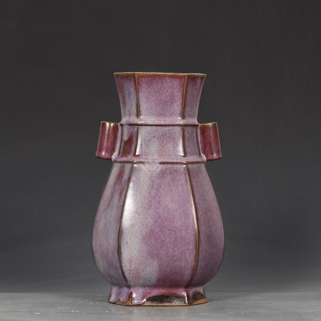 A rose purple glaze imperial inscription of the Song Dynasty Jun kiln Bafang piercing ear bottle: The rose purple glaze imperial inscription of the Song Dynasty Jun kiln is an eight-sided ear piercing bottle Size:H:26.5cmCalibre:10.2cmBellydiameter:15.5cm (The Dimensions Of All