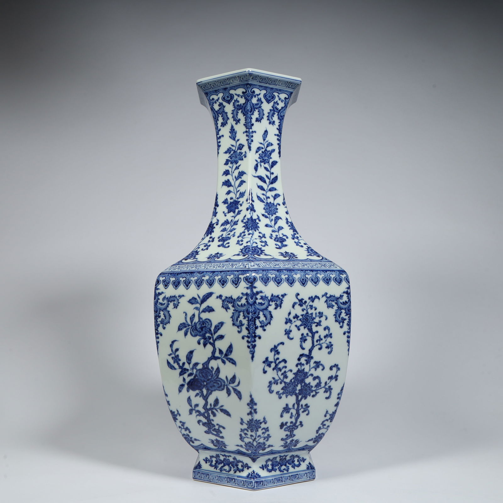 A Qing Dynasty Qianlong style blue and white entwined floral pattern hexagonal long neck bottle (1 of 10)