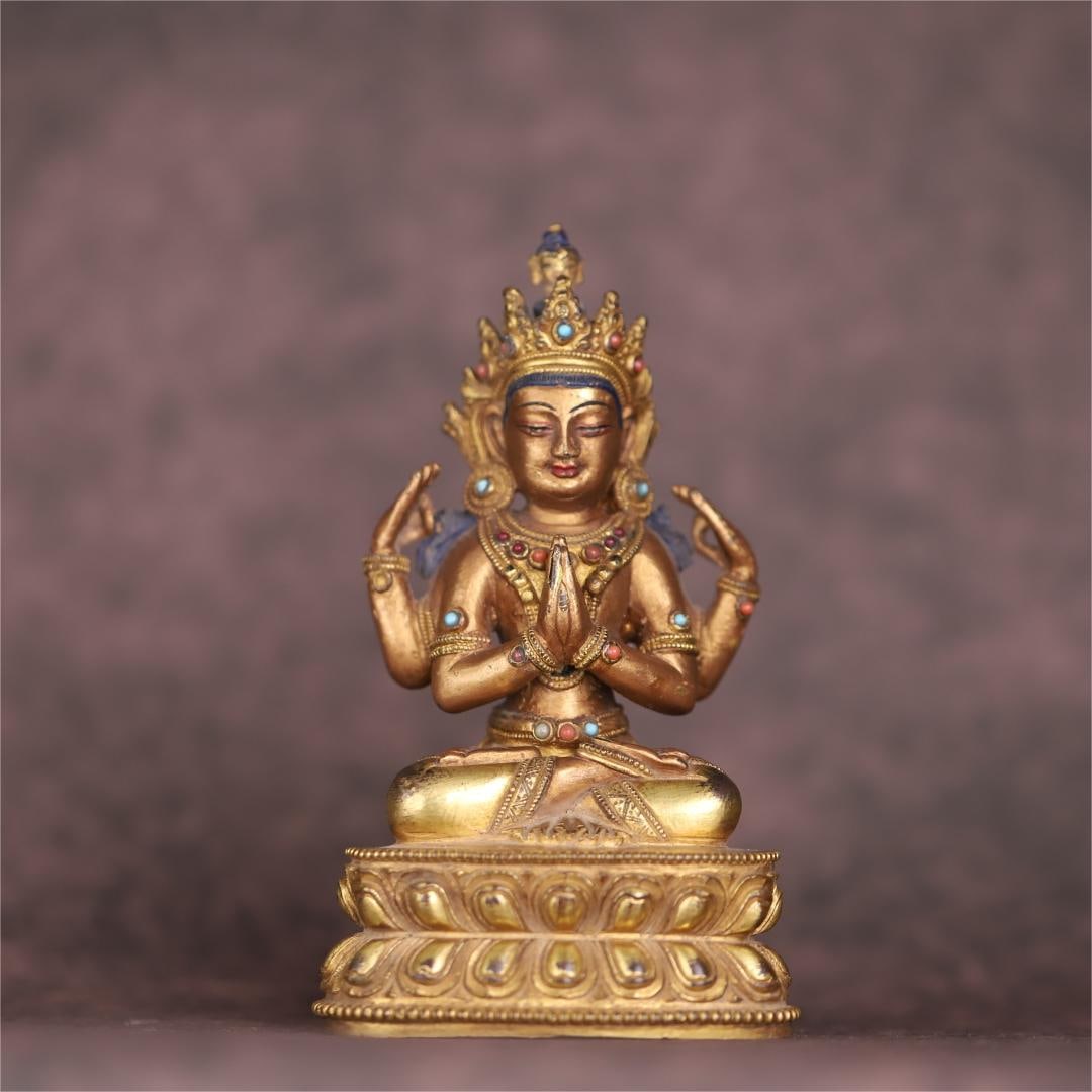 A bronze gilt statue of Guanyin with multiple treasures inlaid in Qing Dynasty: The bronze gilt of the Qing Dynasty inlaid with multiple treasures and the four-armed Guanyin statue Size:H:14.58.55.7cmW:0.5957kg (The Dimensions Of All Batches Are Manually Measured.If You Need More