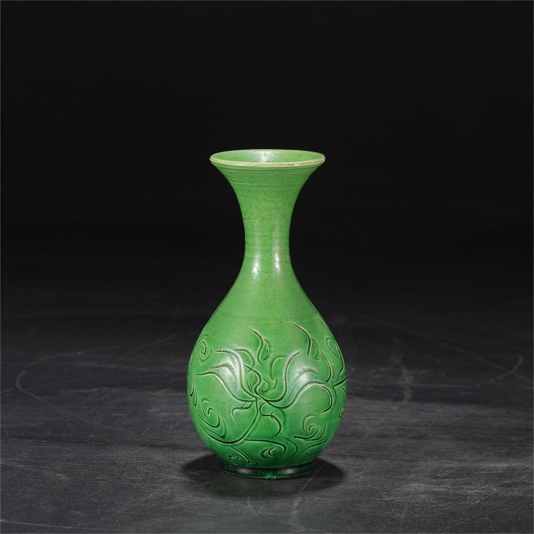 A green glaze carved flower pattern jade pot spring vase from the Song Dynasty Ding kiln (1 of 7)