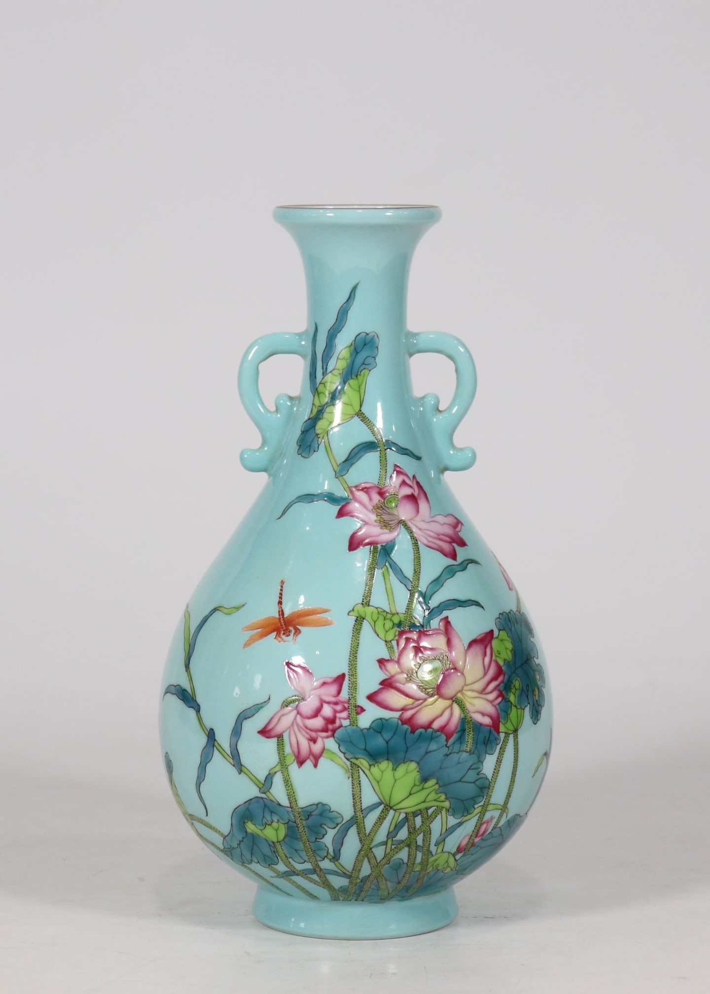 An Exquisite Enamel Green Ground Flower Pattern with poem Double-Ears Vase: An Exquisite Enamel Green Ground Flower Pattern with poem Double-Ears Vase Qing Dynasty, China Yongzheng Six-character Mark Size:22cmx12cm (The Dimensions Of All Batches Are Manually Measured.If You N
