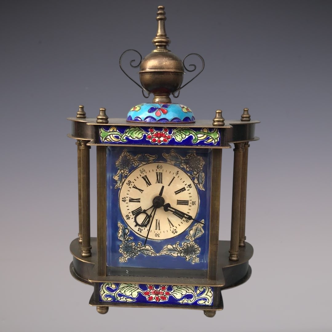 An Exquisite Bronze Lotus Pattern Clock: An Exquisite Bronze Lotus Pattern Clock Qing Dynasty, China Size:15cmx8cmx22cm (The Dimensions Of All Batches Are Manually Measured.If You Need More Detailed Information, Please Contact Our Customer S