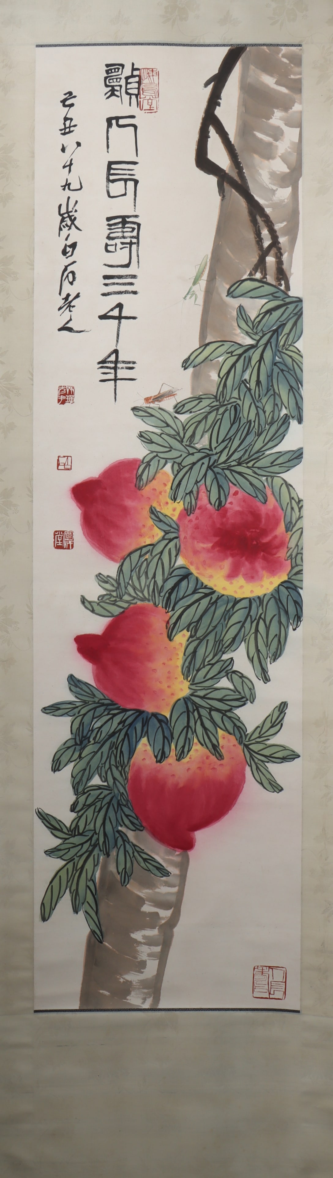 A Chinese Vertical Scroll Ink Painting of Flower and Fruit on Paper: A Chinese Vertical Scroll Ink Painting of Flower and Fruit on Paper Qi baishi Size:161cmx45cm (The Dimensions Of All Batches Are Manually Measured.If You Need More Detailed Information, Please