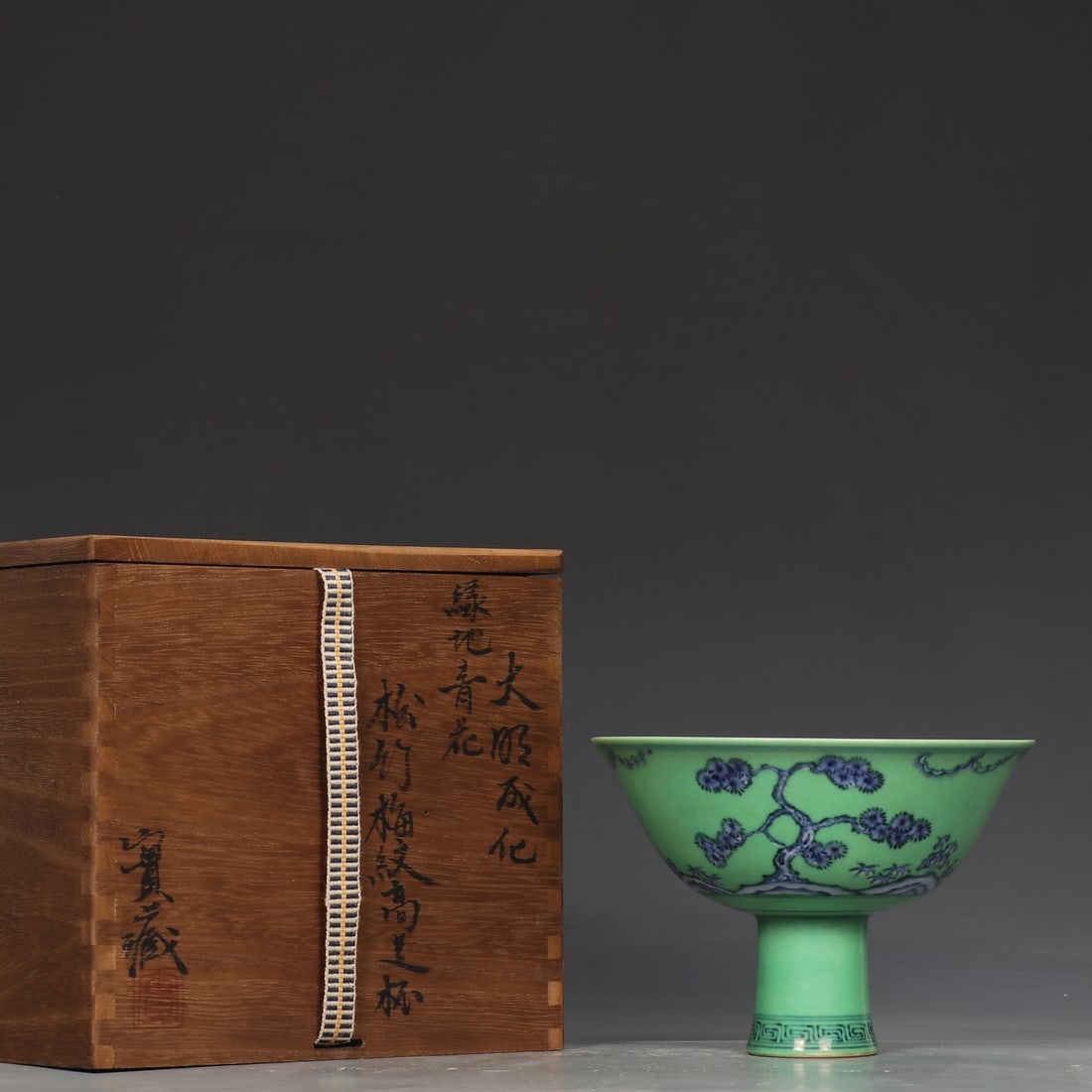 An Exquisite Blue and White Green Ground Pine, Bamboo and Plum Blossom Pattern Cup: An Exquisite Blue and White Green Ground Pine, Bamboo and Plum Blossom Pattern Cup Ming Dynasty, China Chenghua Six-character Mark Size:11.2cmx16cm (The Dimensions Of All Batches Are Manually Measured