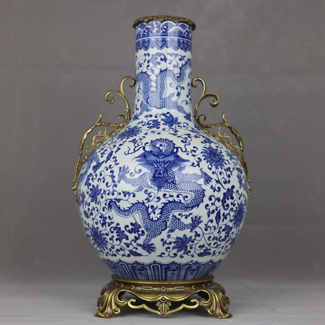 An Exquisite Blue and White Inlaid Bronze Dragon Pattern Lotus Pattern Seawater Pattern Double-Ears: An Exquisite Blue and White Inlaid Bronze Dragon Pattern Lotus Pattern Seawater Pattern Double-Ears Vase Qing Dynasty, China Qianlong Six-character Mark Size:53cmx32cm (The Dimensions Of All