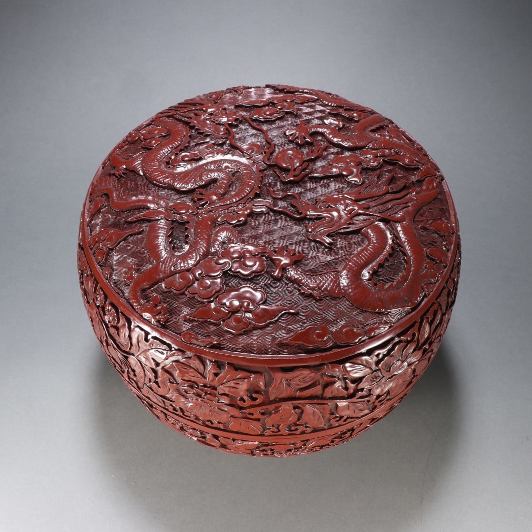 An Exquisite Carved Red Lacquer Dragon Pattern Lotus Pattern Box: An Exquisite Carved Red Lacquer Dragon Pattern Lotus Pattern Box Qing Dynasty, China Qianlong Six-character Mark Size:21cmx27cm Weight:2157.3g (The Dimensions Of All Batches Are Manually Measured.If Y