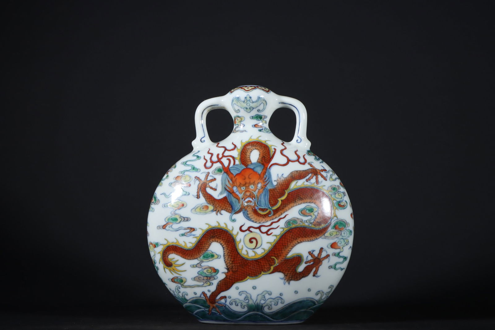An Exquisite Doucai Seawater Pattern Dragon Pattern Double-Ears Vase: An Exquisite Doucai Seawater Pattern Dragon Pattern Double-Ears Vase Qing Dynasty, China Qianlong Six-character Mark Size:21cmx19cm (The Dimensions Of All Batches Are Manually Measured.If You Need