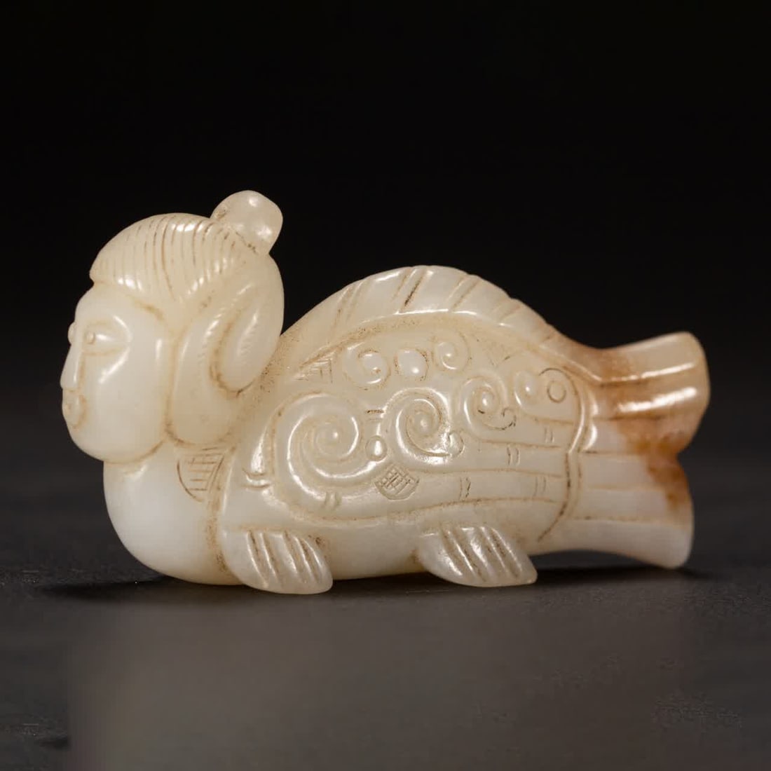 A Hetian jade fish body human face ornament from the Qing Dynasty: Qing Dynasty Hetian jade fish body human face ornament SIZE: L:7.5cm W:4cm (The Dimensions Of All Batches Are Manually Measured.If You Need More Detailed Information, Please Contact Our Customer Servi
