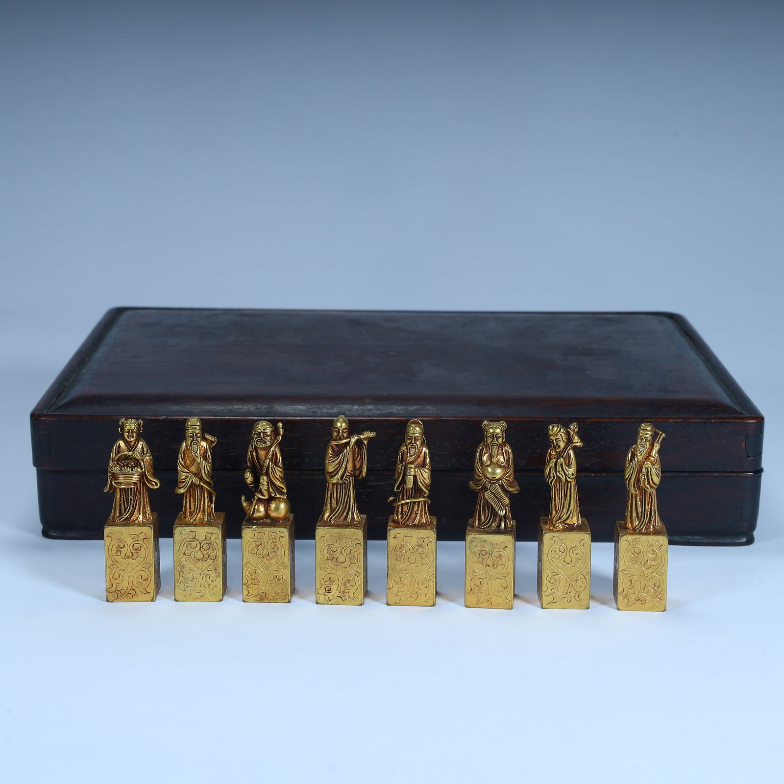 A set of Qing Dynasty copper gilt Eight Immortals seals, with mahogany boxes: Qing Dynasty copper gilt Eight Immortals seal, with mahogany box SIZE: H:54cm L:1.5cm W:1.5cm W:379g (The Dimensions Of All Batches Are Manually Measured.If You Need More Detailed Information, Please