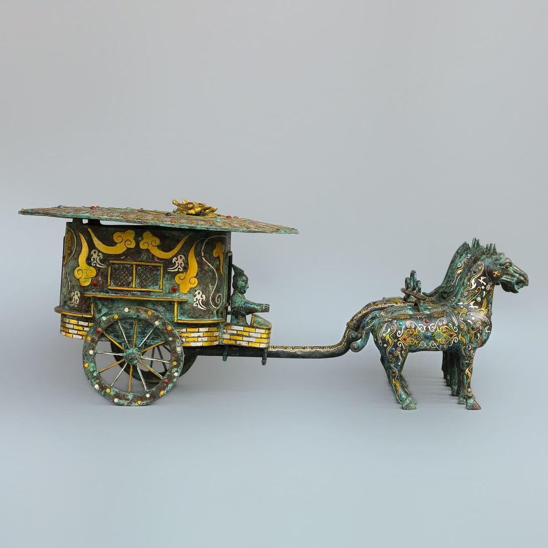 A Han Dynasty bronze Cuo gold and silver inlaid horse-drawn carriage: Han Dynasty bronze Cuo gold and silver inlaid horse-drawn carriage SIZE: W:12.5kg L:80cm H:29cm (The Dimensions Of All Batches Are Manually Measured.If You Need More Detailed Information, Please Conta