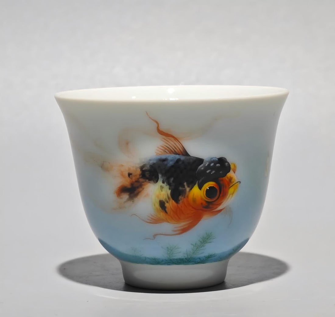 A Yongzheng year enamel colorful Lang Shining painted goldfish poetry cup: Yongzheng year system enamel color Lang Shining painted goldfish poetry cup SIZE: H:5.4cm W:6.6cm (The Dimensions Of All Batches Are Manually Measured.If You Need More Detailed Information, Please Con