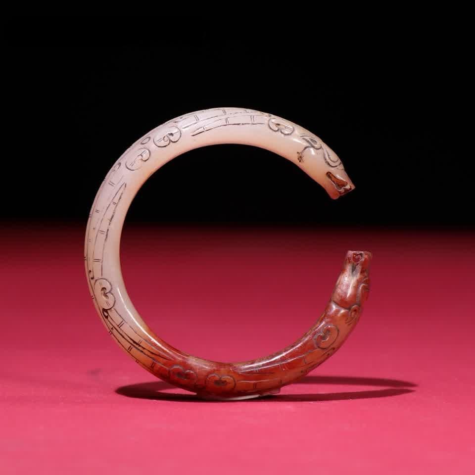 A Han Dynasty jade bracelet: Han Dynasty jade bracelet SIZE: 14x9mm Inner Diameter 51mm W: 56g (The Dimensions Of All Batches Are Manually Measured.If You Need More Detailed Information, Please Contact Our Customer Service Before