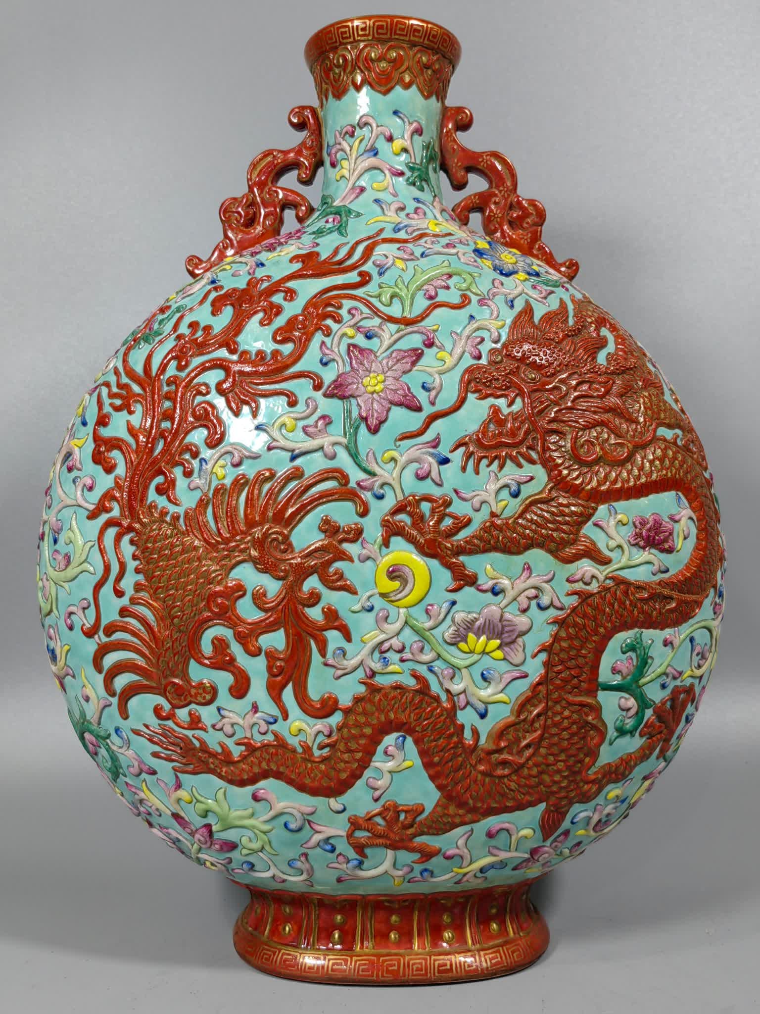 A Qianlong pastel high-relief dragon and phoenix moon vase: Qianlong pastel high-relief dragon and phoenix moon vase SIZE: L:24cm W:14cm H:32cm (The Dimensions Of All Batches Are Manually Measured.If You Need More Detailed Information, Please Contact Our Custo