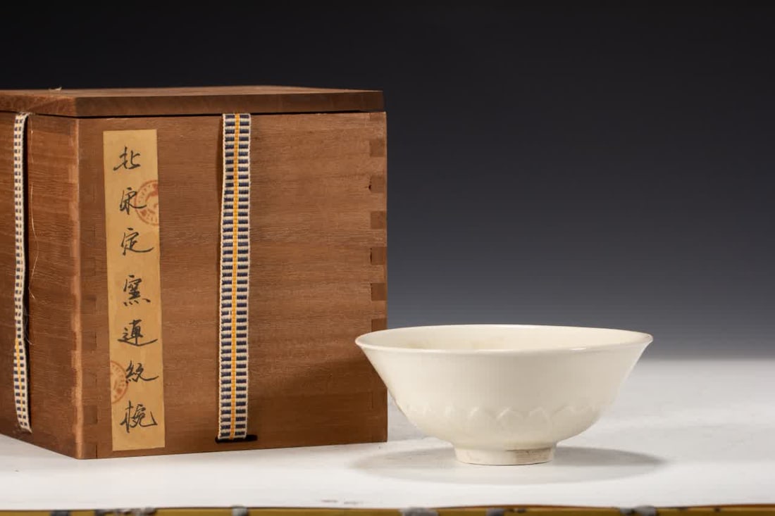 A Song Dynasty Ding kiln lotus pattern bowl: Song Dynasty Ding kiln lotus pattern bowl SIZE: L:13cm W:13cm H:5cm W:120g (The Dimensions Of All Batches Are Manually Measured.If You Need More Detailed Information, Please Contact Our Customer Servi