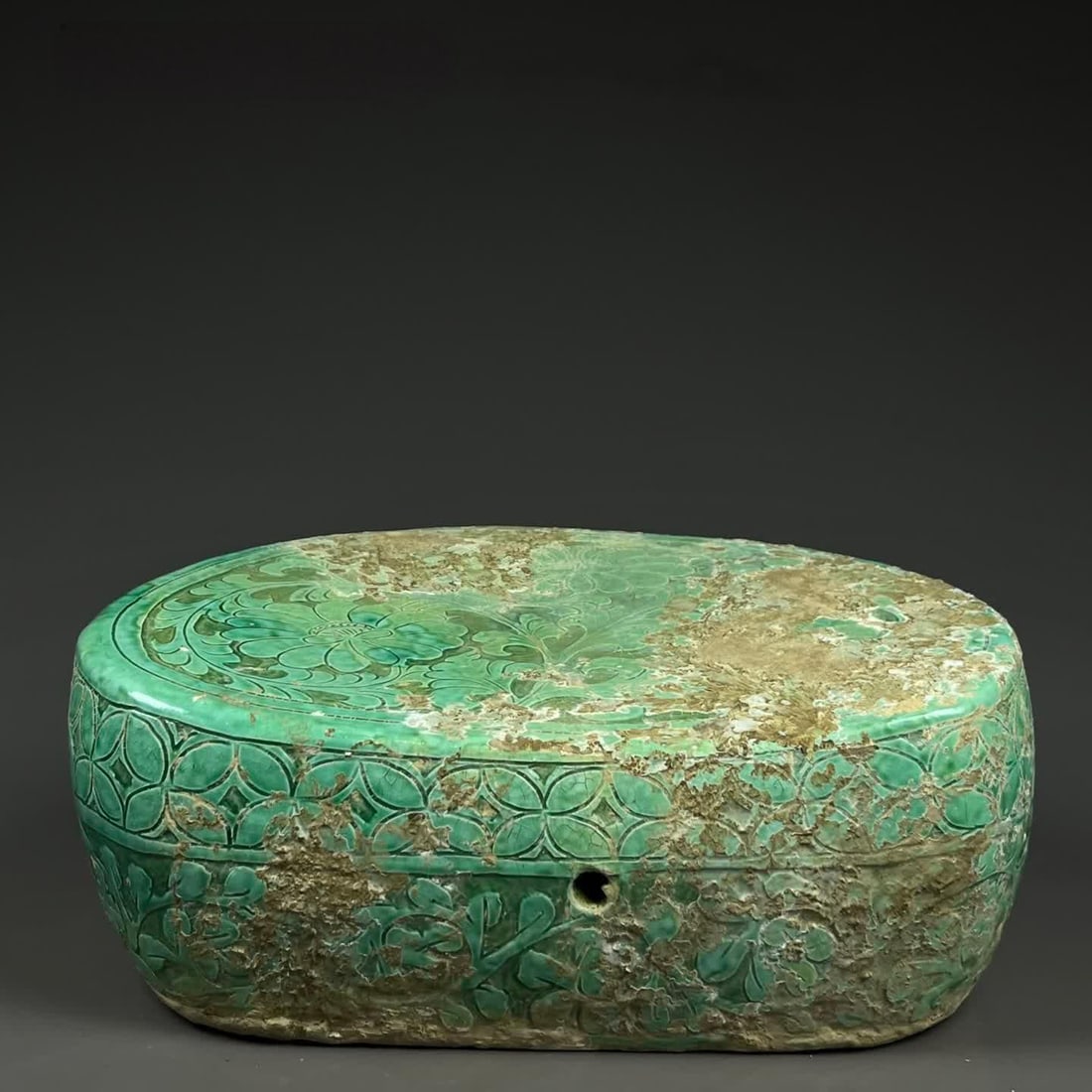 A Song Dynasty kiln green glazed flower ingots pillow: Song Dynasty kiln green glazed flower ingots pillow SIZE: H:12cm W:26cm (The Dimensions Of All Batches Are Manually Measured.If You Need More Detailed Information, Please Contact Our Customer Service