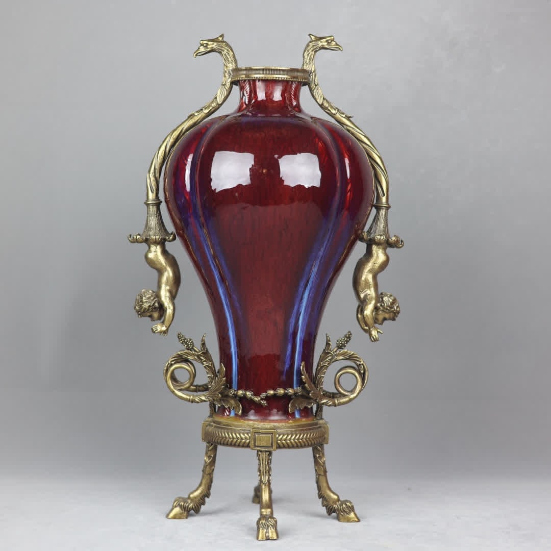 A Qing Dynasty Lang kiln red kiln transformed into a copper melon edge plum bottle: Qing Dynasty Lang kiln red kiln changed to copper inlaid melon edge plum bottle SIZE: H:50cm mouthD:8cm D:27cm Bottom diameter 18cm (The Dimensions Of All Batches Are Manually Measured.If You Need Mor