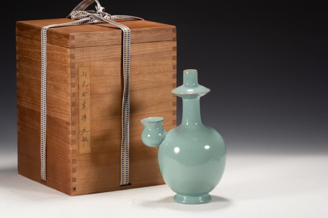 A Song Dynasty Ru kiln water purification bottle: Ru kiln water purification bottle in the Song Dynasty SIZE: L:14cm W:11cm H:22cm (The Dimensions Of All Batches Are Manually Measured.If You Need More Detailed Information, Please Contact Our Customer