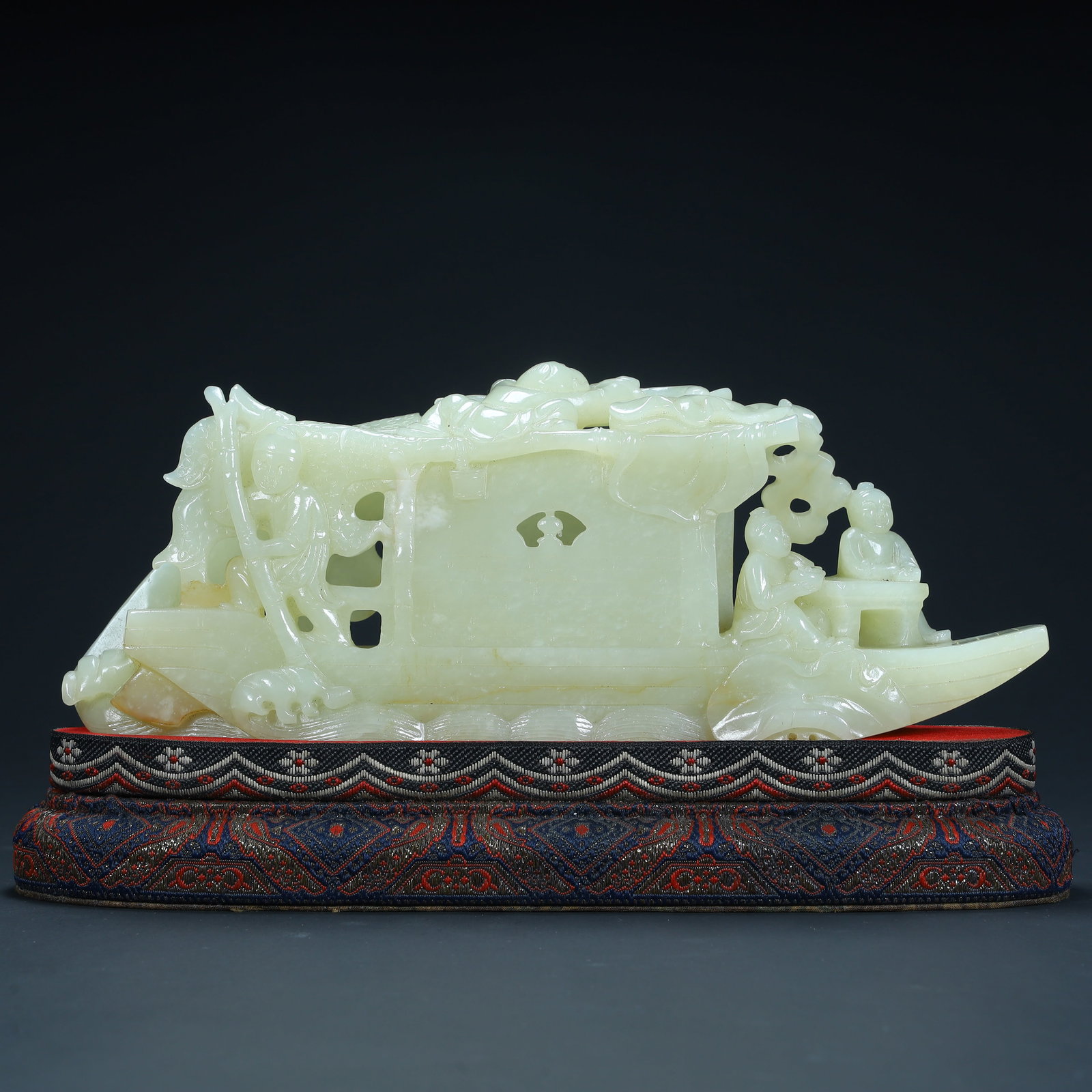 A Qing Dynasty Hetian jade "literati boating" pattern ornament: Qing Dynasty Hetian jade "literati boating" pattern ornament SIZE: H:9.5cm L:23cm W:5cm W:882g (The Dimensions Of All Batches Are Manually Measured.If You Need More Detailed Information, Please Contac