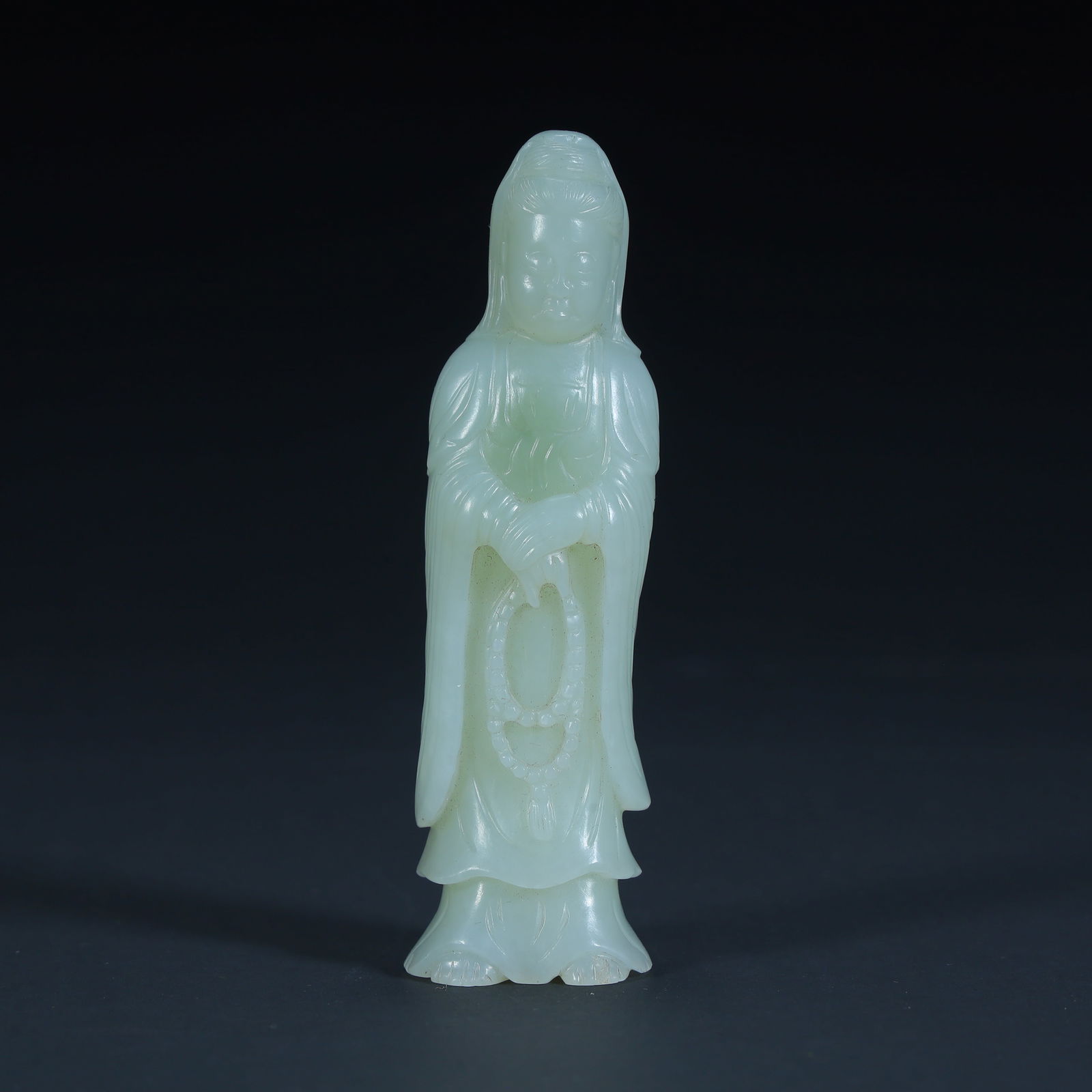 A Qing Dynasty Hetian jade Guanyin statue ornament: Qing Dynasty Hetian jade Guanyin statue ornament SIZE: H:8.8cm L:2.5cm W:2cm W:64.4g (The Dimensions Of All Batches Are Manually Measured.If You Need More Detailed Information, Please Contact Our
