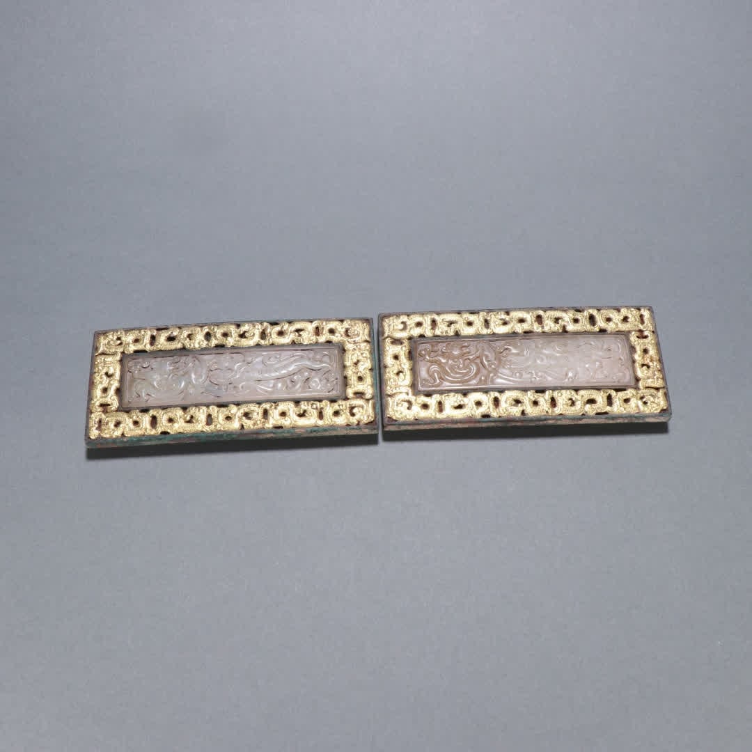 A pair of Han Dynasty copper gilt inlaid jade buckles: Han Dynasty A pair of copper-gilded jade buckles SIZE: H: 11.5cm W: 5cm Single W: 269.9g (The Dimensions Of All Batches Are Manually Measured.If You Need More Detailed Information, Please Contact Our