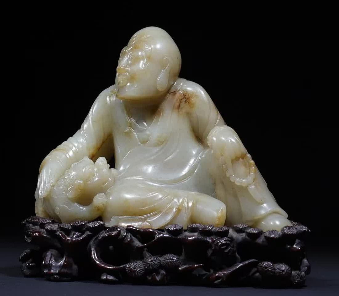 A Qing Dynasty Hetian jade Arhat drama auspicious beast study offering: Qing Dynasty Hetian Jade Arhat Drama Auspicious Beast Study Qing Offering This work is carved from Hetian seed material The jade is condensed as fat, the whole body has a natural yellow-brown color, t