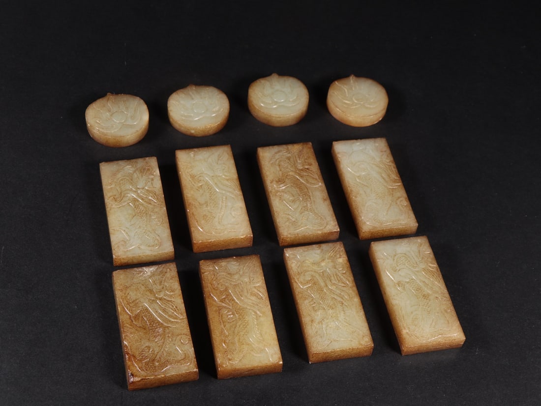 A Set of Fine White Jade Dragon Pattern Ornament: A Set of Fine White Jade Dragon Pattern Ornament Liao Dynasty, China Size:5.7cmx2.7cmx0.8cm Size:3.1cmx3.1cmx.7cm Weight:351g (The Dimensions Of All Batches Are Manually Measured.If You Need More Deta