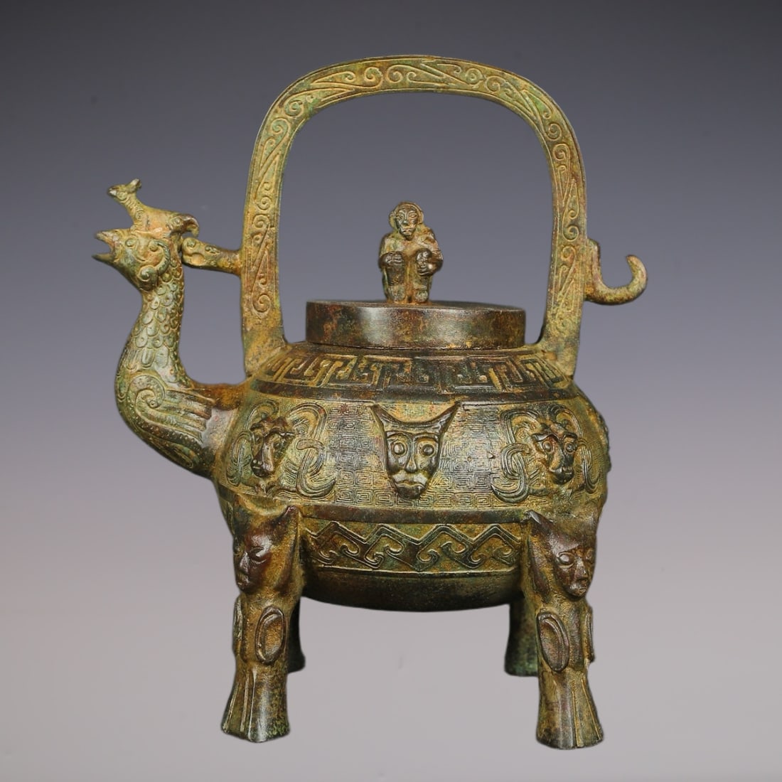 An Exquisite Bronze Beast-Face Pattern Tripod Ewer: An Exquisite Bronze Beast-Face Pattern Tripod Ewer W.Zhou , China Size:22cmx26cm Weight:2300g (The Dimensions Of All Batches Are Manually Measured.If You Need More Detailed Information, Please Contact