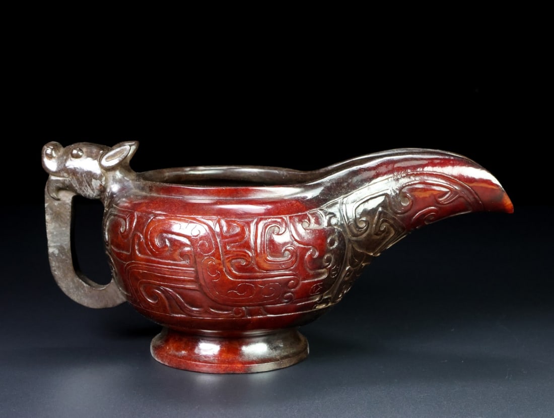 An Exquisite White Jade Ewer: An Exquisite White Jade Ewer Han Dynasty, China Size:21.6cmx8.3cmx11.2cm Weight:613.5g (The Dimensions Of All Batches Are Manually Measured.If You Need More Detailed Information, Please Contact Our Cu