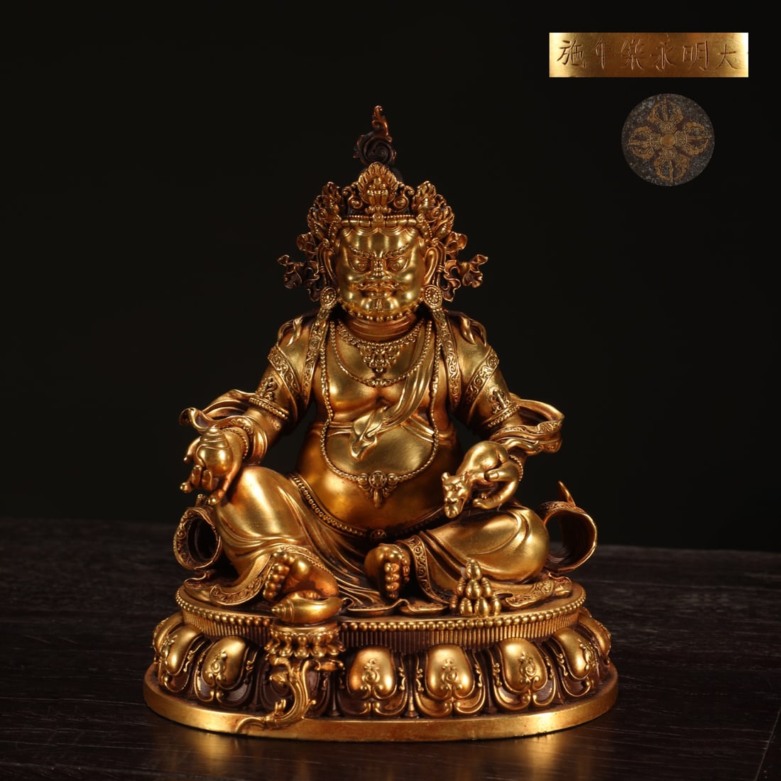 An Exquisite Gilt Bronze Statue of Mammon: An Exquisite Gilt Bronze Statue of Mammon Ming Dynasty, China Yongle Six-character Mark Size:14.3cmx11.9cm Weight:1.95kg (The Dimensions Of All Batches Are Manually Measured.If You Need More Detailed
