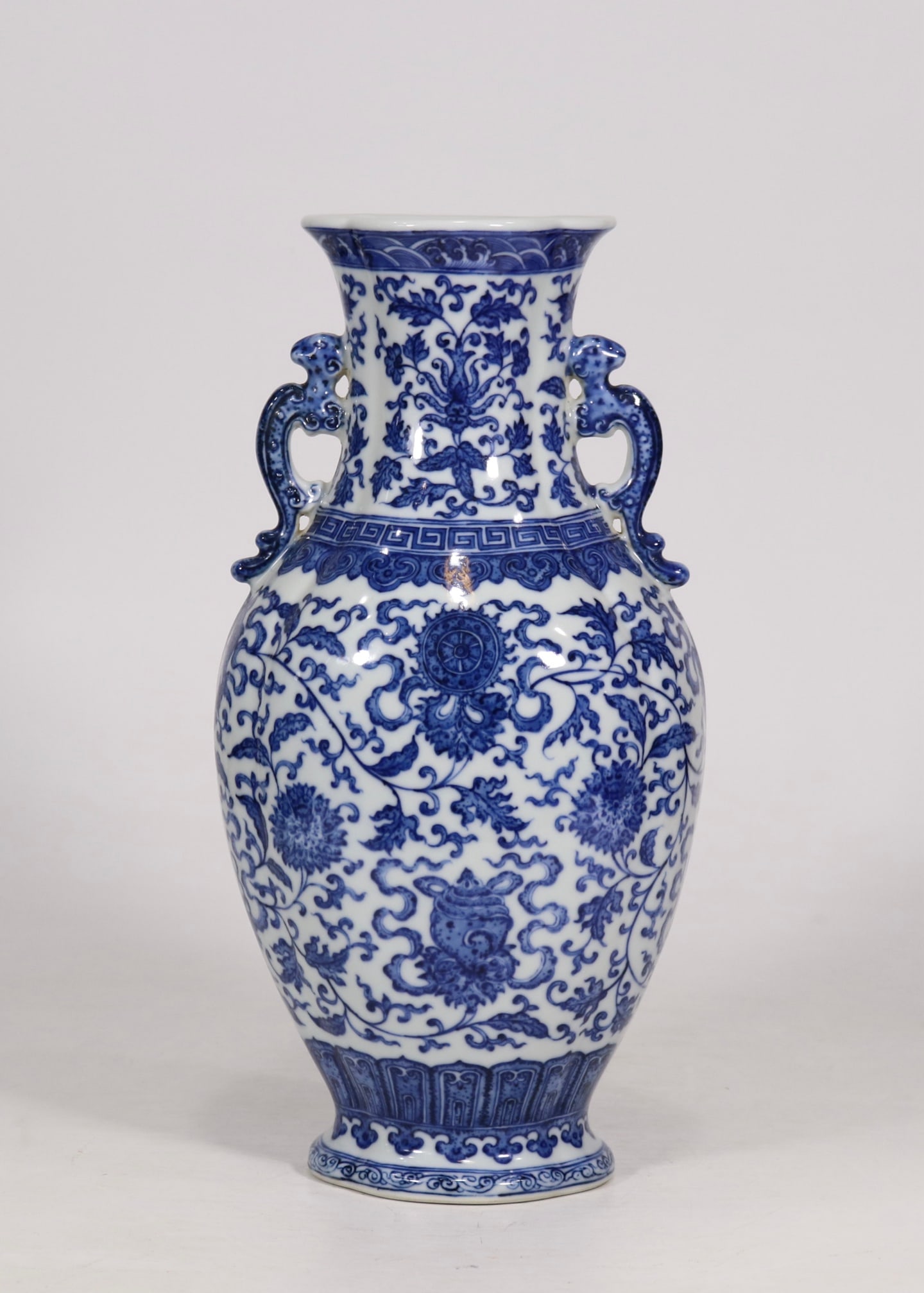 An Exquisite Blue and White Lotus Pattern Seawater Pattern Eight Treasures Pattern Double-Ears Vase: An Exquisite Blue and White Lotus Pattern Seawater Pattern Eight Treasures Pattern Double-Ears Vase Qing Dynasty, China Qianlong Six-character Mark Size:30.6cmx14.5cm (The Dimensions Of All Batches Ar