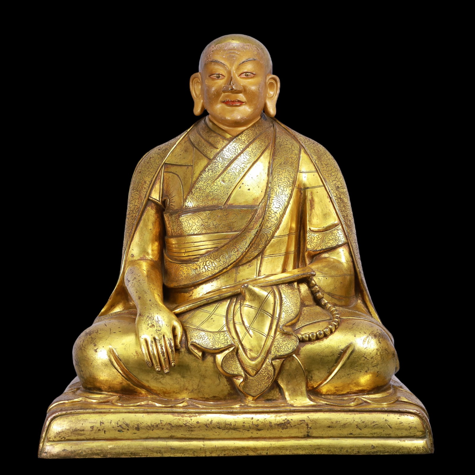 A Exquisite Gilt Bronze Statue of Guru: A Exquisite Gilt Bronze Statue of Guru Ming Dynasty, China Size:51cmx32cmx60cm Weight:41550g (The Dimensions Of All Batches Are Manually Measured.If You Need More Detailed Information, Please Contact