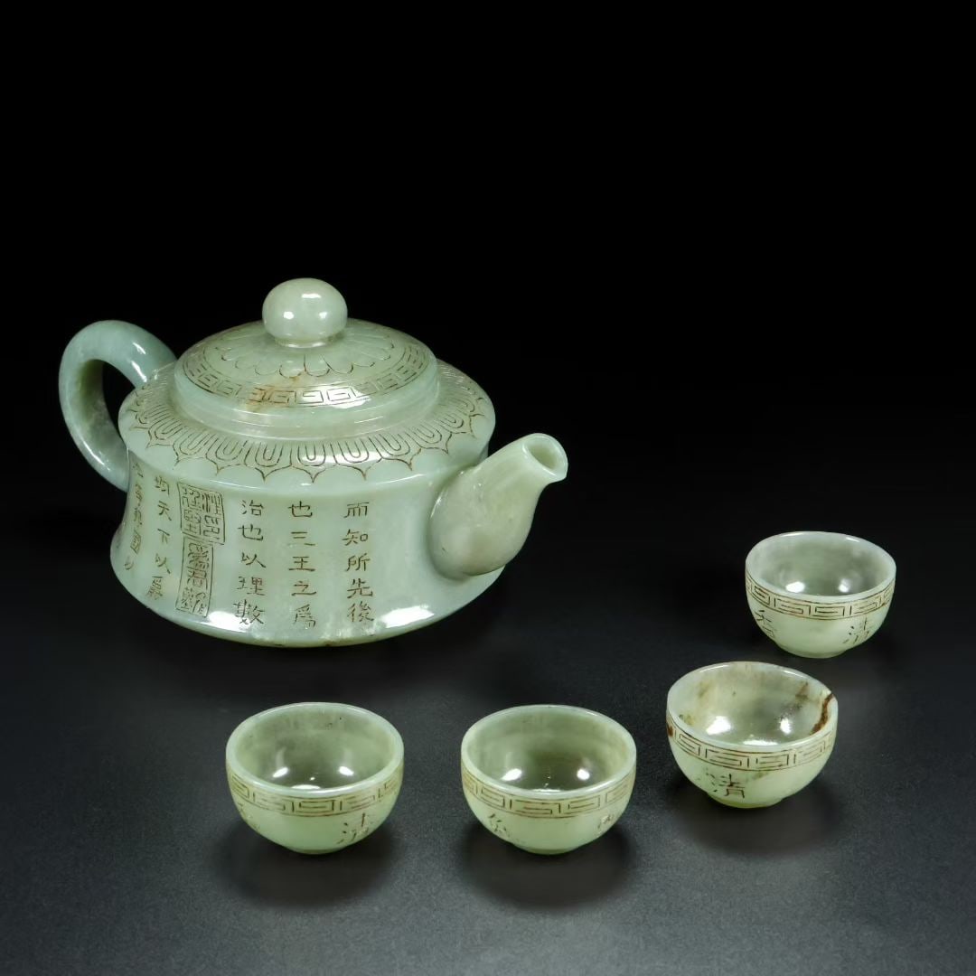 A Set of Fine White Jade with poem Teapot Cup: A Set of Fine White Jade with poem Teapot Cup Qing Dynasty, China Qianlong Four-character Mark Size:19cmx11cmx12cm Size:2.5cmx4cm Weight:381g (The Dimensions Of All Batches Are Manually Measured.If Yo