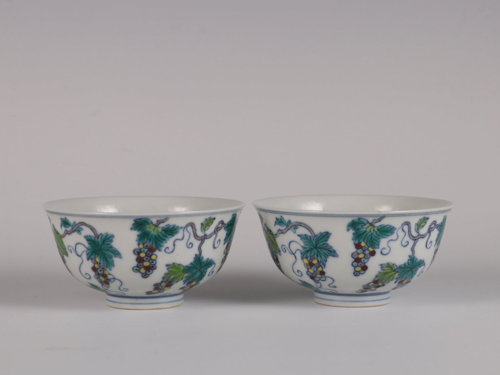 A Pair of Exquisite Doucai Grapes Pattern Cup: A Pair of Exquisite Doucai Grapes Pattern Cup Qing Dynasty, China Yongzheng Six-character Mark Size:5cmx9.3cm (The Dimensions Of All Batches Are Manually Measured.If You Need More Detailed Information