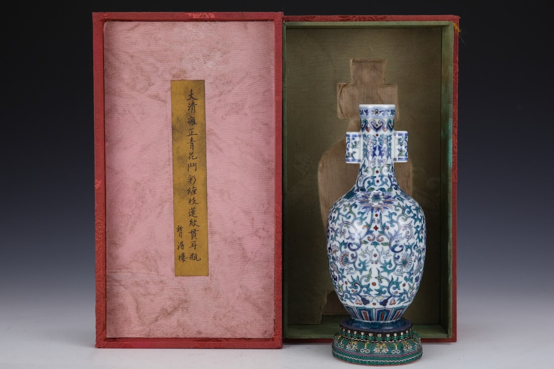 An Exquisite Doucai Blue and White Lotus Pattern Double-Ears Vase: An Exquisite Doucai Blue and White Lotus Pattern Double-Ears Vase Qing Dynasty, China Yongzheng Six-character Mark Size:19cmx8.3cm (The Dimensions Of All Batches Are Manually Measured.If You Need More
