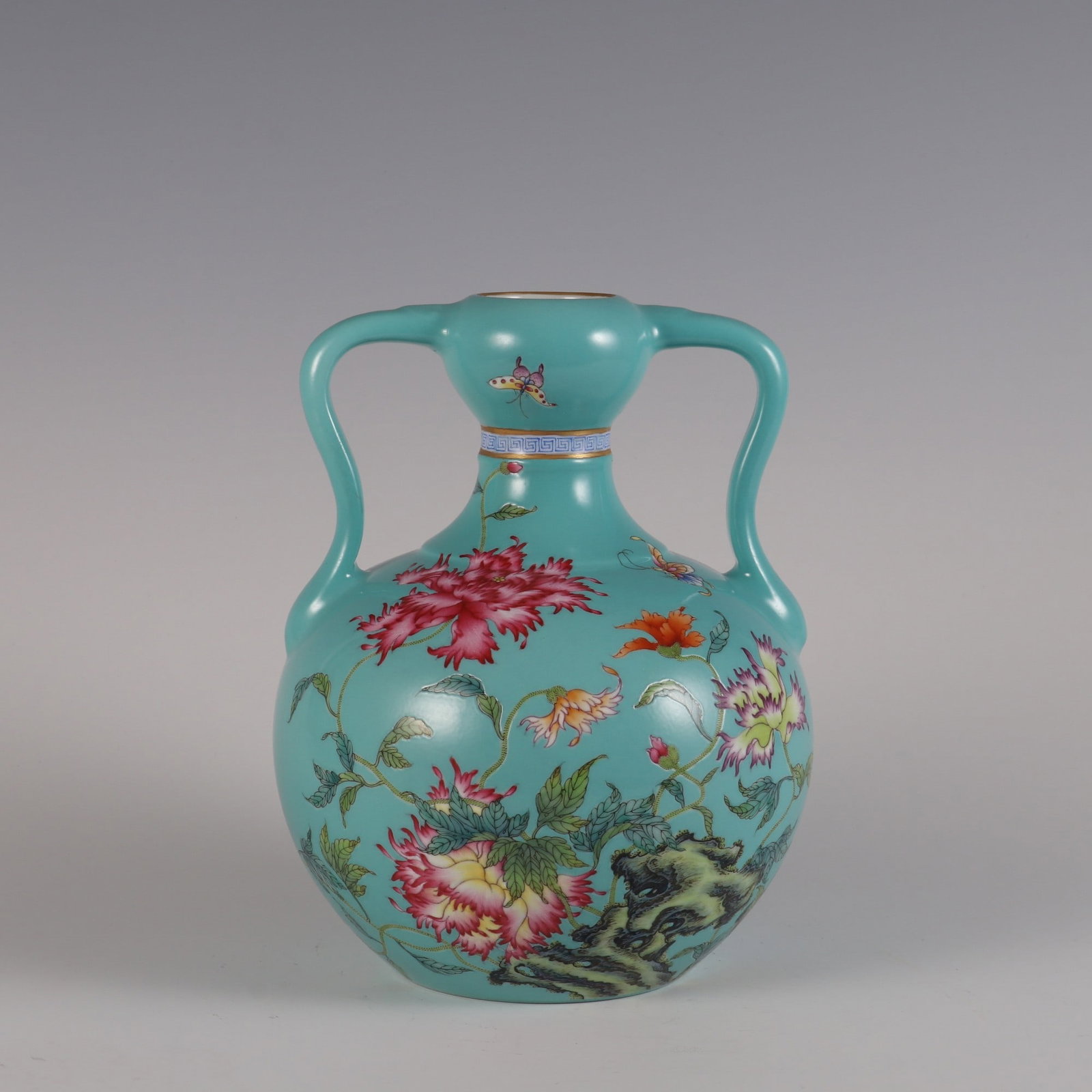 An Exquisite Famille-Rose Green Ground Flower and Butterfly Pattern with poem Double-Ears Vase: An Exquisite Famille-Rose Green Ground Flower and Butterfly Pattern with poem Double-Ears Vase Qing Dynasty, China Qianlong Six-character Mark Size:21.2cmx16.5cm (The Dimensions Of All Batches Are Man