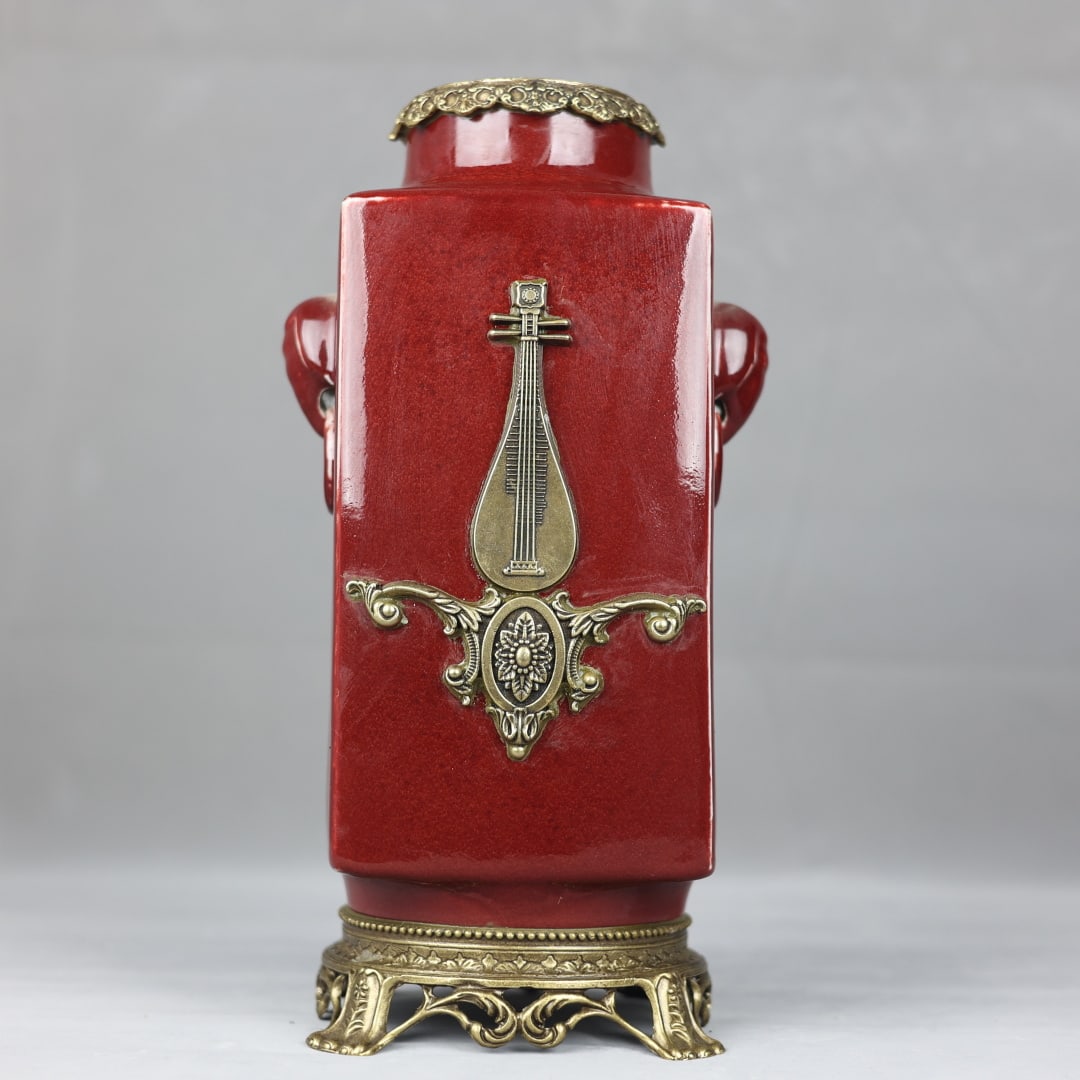 An Exquisite Red Glazed Inlaid Bronze Double-Ears Vase: An Exquisite Red Glazed Inlaid Bronze Double-Ears Vase Qing Dynasty, China Yongzheng Six-character Mark Size:35cmx18cm (The Dimensions Of All Batches Are Manually Measured.If You Need More Detailed In