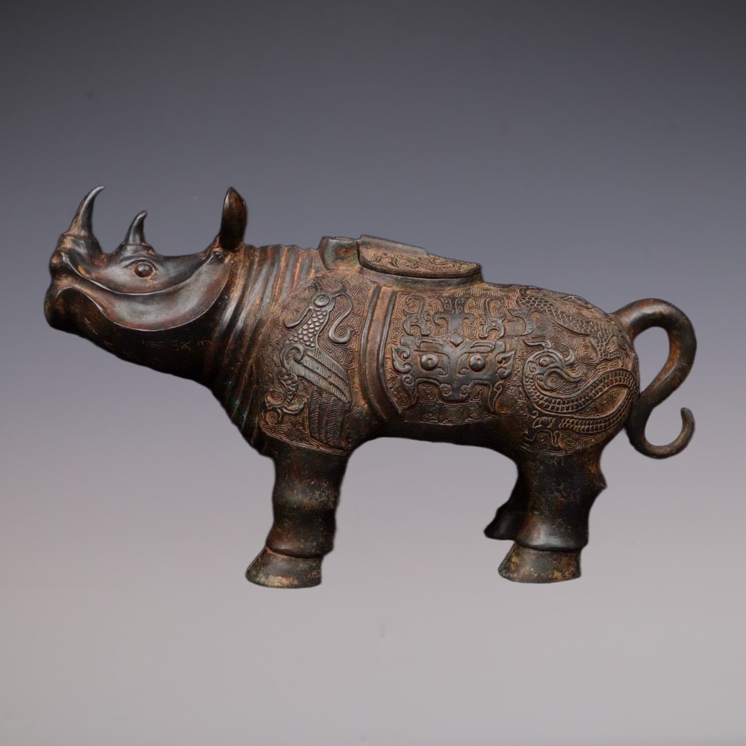An Exquisite Bronze Beast-Face Pattern Rhinoceros-Shaped Censer: An Exquisite Bronze Beast-Face Pattern Rhinoceros-Shaped Censer W.Zhou , China Size:43cmx14cmx25cm Weight:4400g (The Dimensions Of All Batches Are Manually Measured.If You Need More Detailed Informati