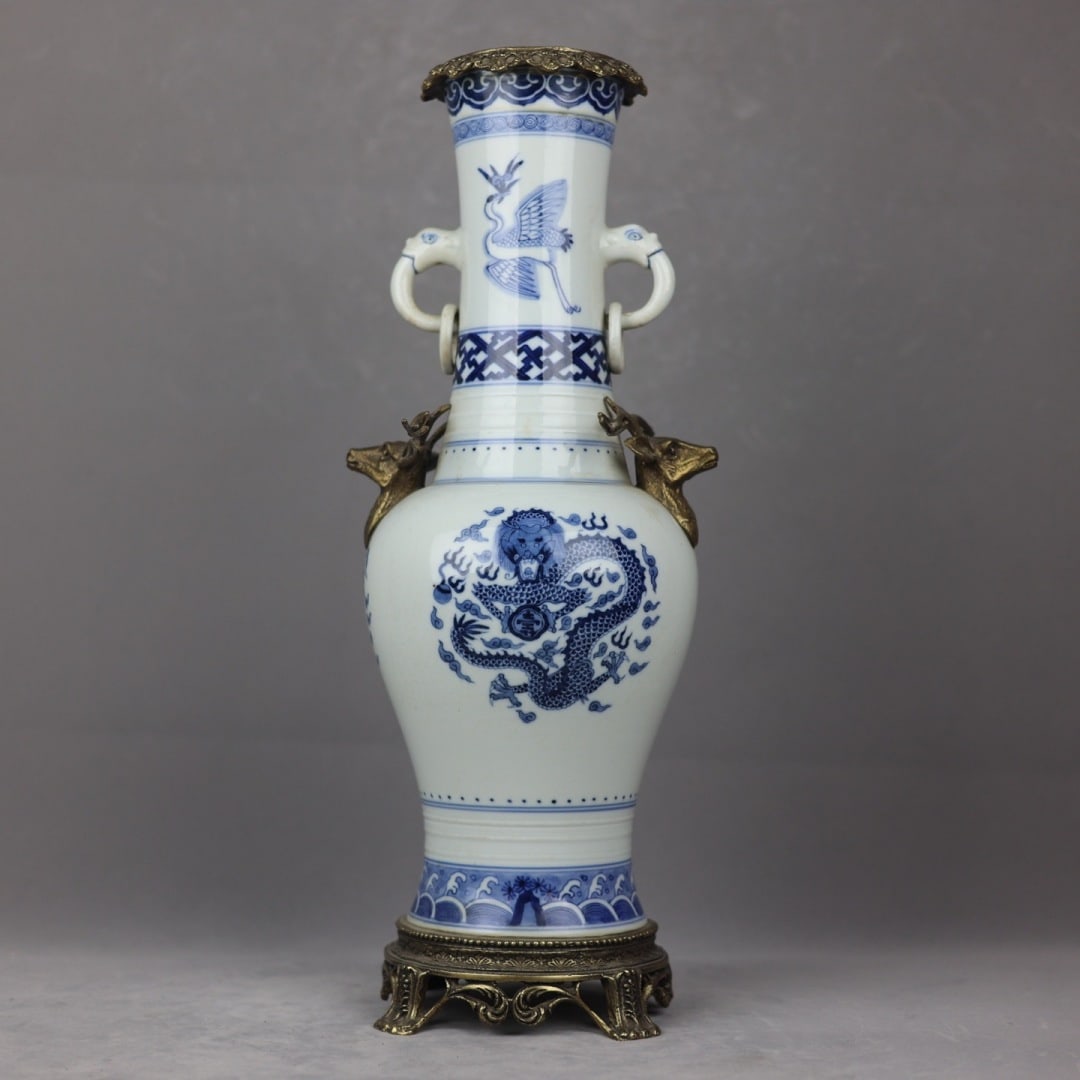 An Exquisite Blue and White Inlaid Bronze Dragon Pattern Seawater Pattern Double-Ears Vase: An Exquisite Blue and White Inlaid Bronze Dragon Pattern Seawater Pattern Double-Ears Vase Qing Dynasty, China Kangxi Six-character Mark Size:49cmx18cm (The Dimensions Of All Batches Are Manually Meas