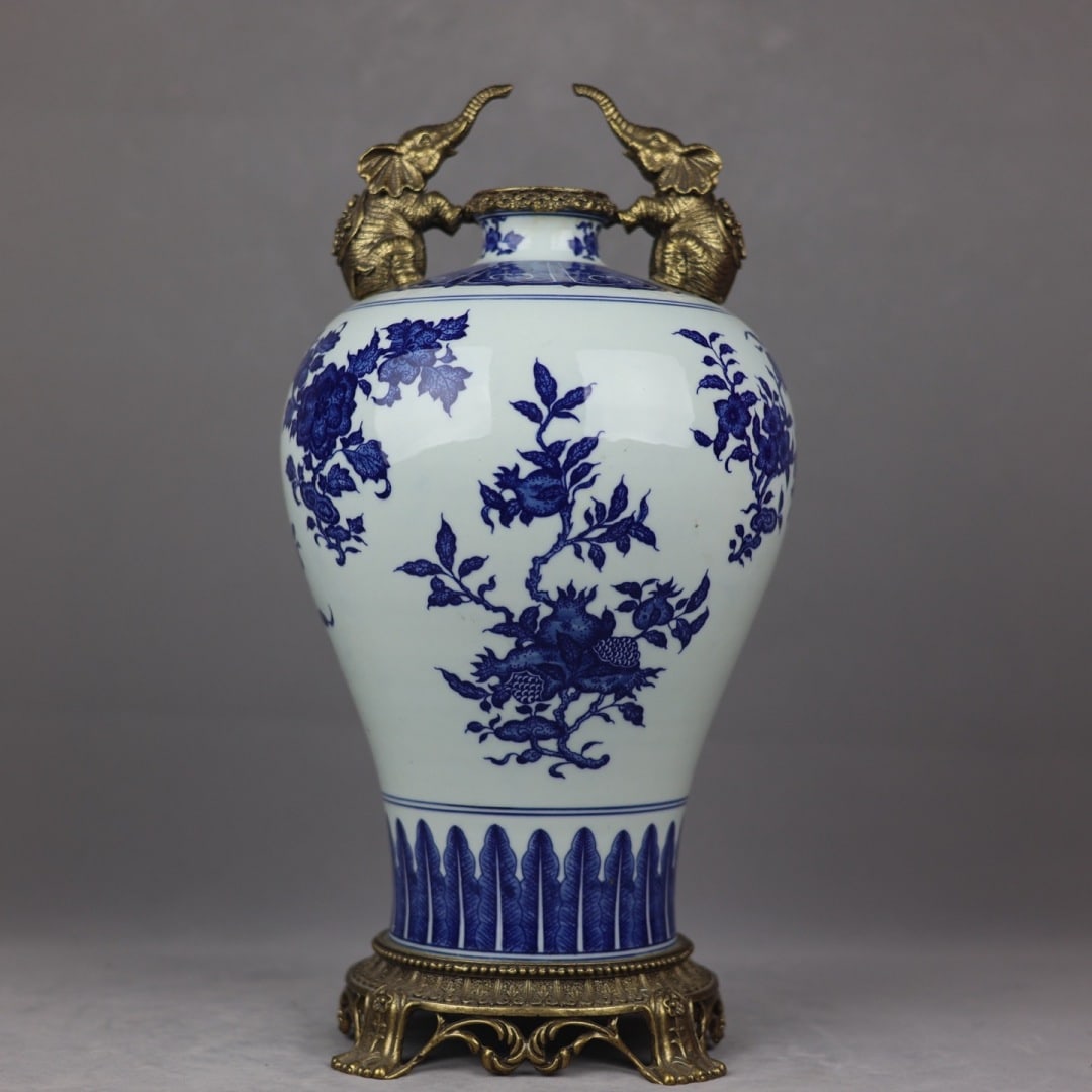 An Exquisite Blue and White Inlaid Bronze Flower and Fruit Pattern Double-Ears Vase: An Exquisite Blue and White Inlaid Bronze Flower and Fruit Pattern Double-Ears Vase Qing Dynasty, China Qianlong Six-character Mark Size:42cmx21cm (The Dimensions Of All Batches Are Manually Measured.