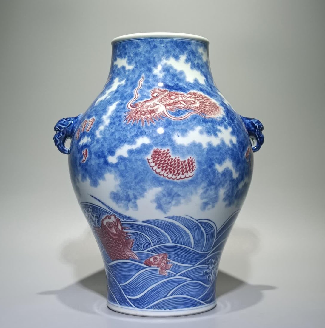 A Qing Qianlong blue and white glazed red fish leaping dragon gate amphora olive bottle: Qing Qianlong blue and white glaze red fish leaping dragon gate amphora olive bottle SIZE: H:29.8cm W:22cm (The Dimensions Of All Batches Are Manually Measured.If You Need More Detailed Information, P