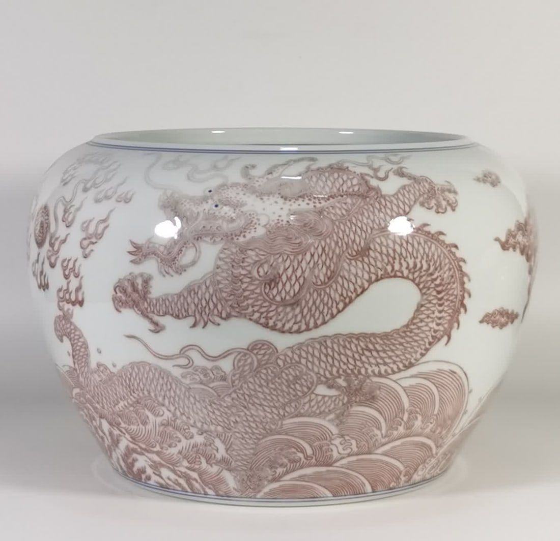 A Qing Kangxi firewood kiln glazed red double dragon bead jar: Qing Kangxi firewood kiln glazed red double dragon bead jar SIZE: H: 19cm mouthD: 21cm Belly diameter 26cm (The Dimensions Of All Batches Are Manually Measured.If You Need More Detailed Information, P