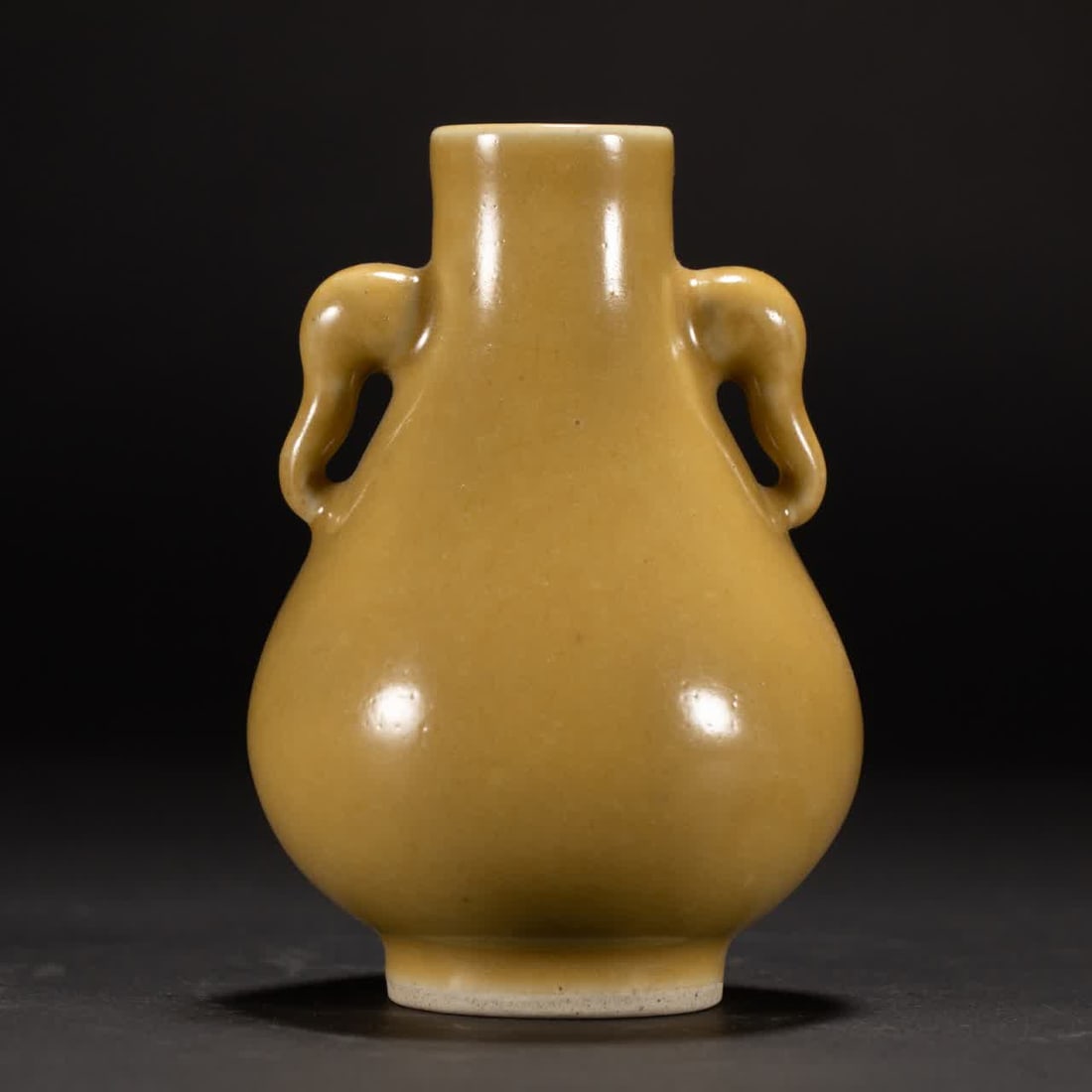 A Qing Dynasty yellow-glazed elephant ear statue: Qing Dynasty yellow glaze elephant ear statue SIZE: L:8.5cm W:8.5cm H:12cm W:300g (The Dimensions Of All Batches Are Manually Measured.If You Need More Detailed Information, Please Contact Our Custome
