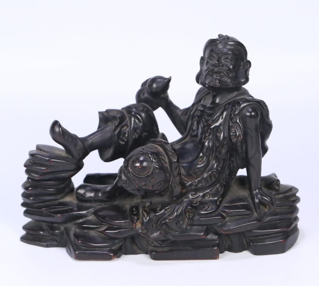 A Qing Dynasty small-leaved rosewood carved iron crutch Li figure ornament (1 of 9)