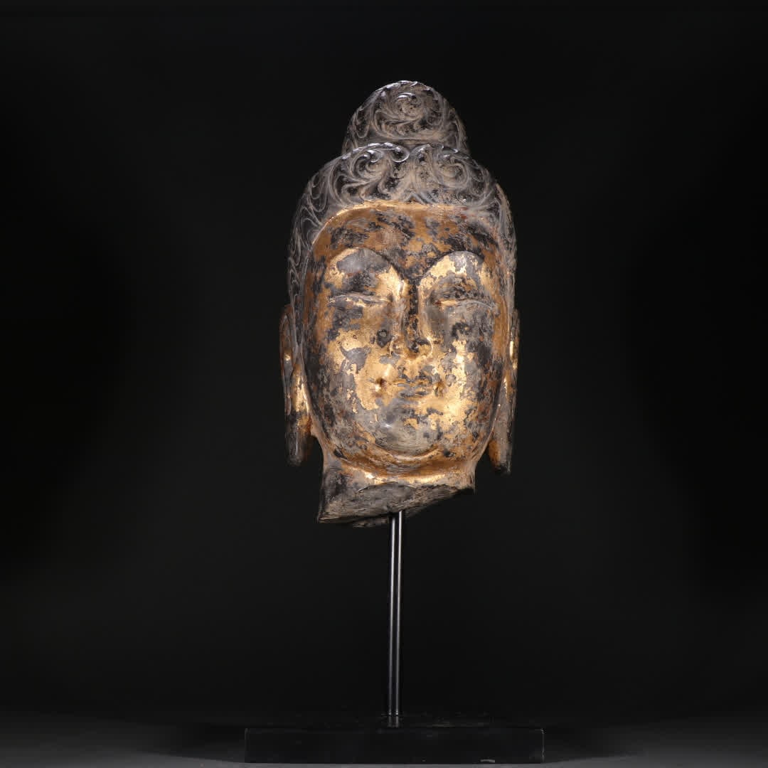 A stone carved gilded Guanyin head: Stone carving gilded Guanyin head SIZE: H:49cm W:18.2cm W:17.2kg (The Dimensions Of All Batches Are Manually Measured.If You Need More Detailed Information, Please Contact Our Customer Service Before 